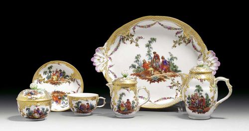 SOLITAIRE, Berlin, KPM, circa 1772. model ‚Neuzierat', with rural scenes in the manner of David Teniers, under a gilt rocaille border in relief, comprising: 1 tray, 1 coffee pot and cover, 1 milk jug and cover, 1 sugar bowl and 1 cup and saucer, sceptre mark in underglaze-blue, tray 29,5cm, finial to milk jug cover restuck.