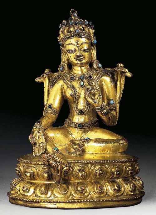 GREEN TARA. On double lotus throne. The face finely crafted. Gilt copper alloy with stone and glass inlays. Tibet, approx 16th century. H 10.5 cm. Berti Aschmann estate