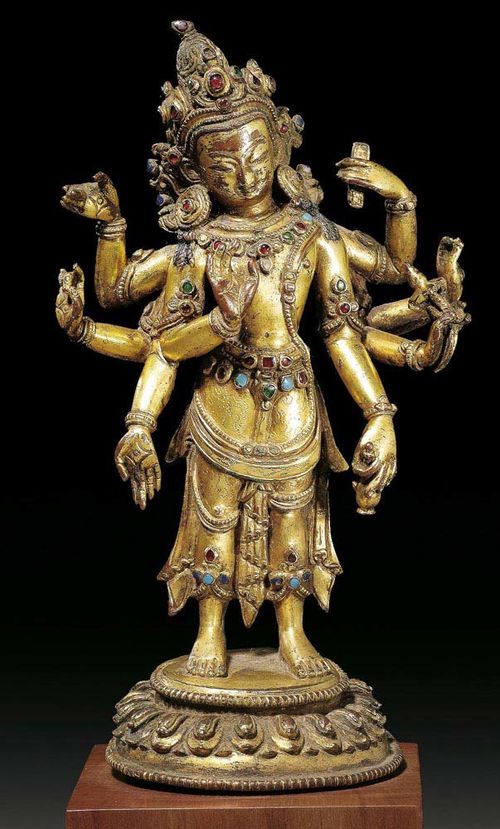 FINE GILT BRONZE FIGURE OF AMOGAPASA. Set with semi-precious stones. A carefully crafted piece with fine detail. Nepal, 15th century. . H 15 cm. Wooden plinth From a Swiss private collection