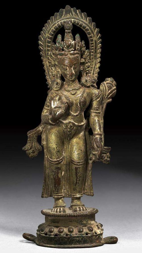 PARCEL-GILT COPPER FIGURE OF STANDING GODDESS (Tara or Lakshmi). Nepal, ca. 17th century. H 14.5 cm. From a Swiss private collection
