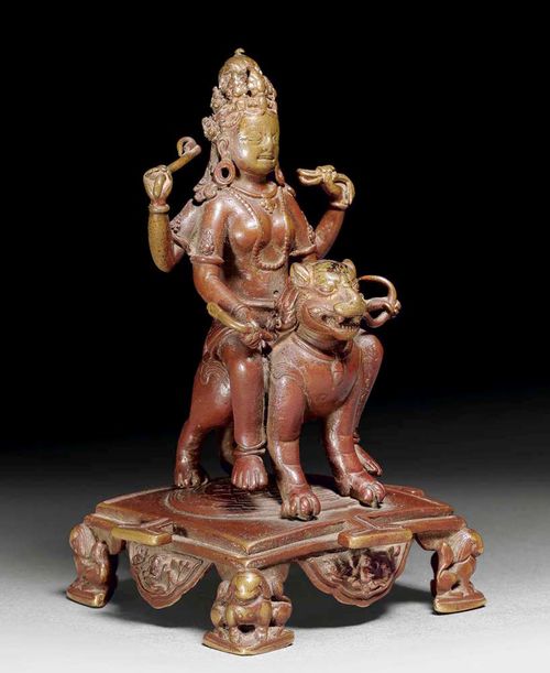 FINE FIGURE OF DURGA. Brass bronze with red-brown patina. Probably part of a Devi-Mandala. Nepal, 14/15th century. H 14 cm. From a German private collection