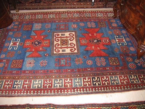 KAZAK old. Blue central field with three medallions, the whole carpet geometric patterned, light border, good condition, 205x145 cm.