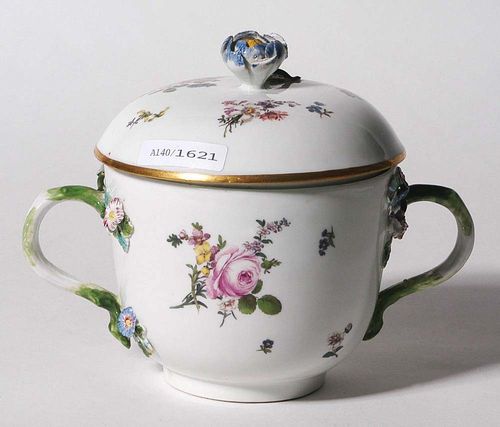 SMALL TUREEN, Meissen, circa 1750.Round form with two branch handles with applied floral sprays. Painted with small bouquets of Manierblumen, the lid with floral finial and similarly painted. With gold edging. Underglaze blue sword mark. H 13.5cm, D 11cm. The lid non-matching. Provenance: from a private collection, Solothurn