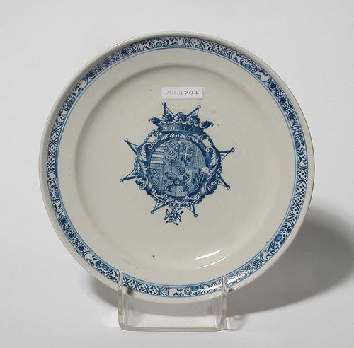 ARMORIAL PLATE, possibly Lille, circa 1730. Painted in blue with coat of arms of a Maltese knight in foliate cartouche with crown. D 23.3 cm.