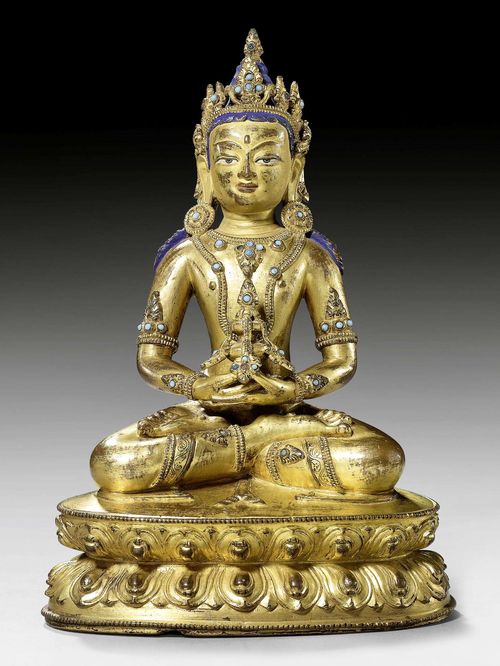 A GILT COPPER ALLOY FIGURE OF AMITAYUS HOLDING THE WATER OF ETERNAL LIFE. Tibet, 15th c. Height 23.5 cm.