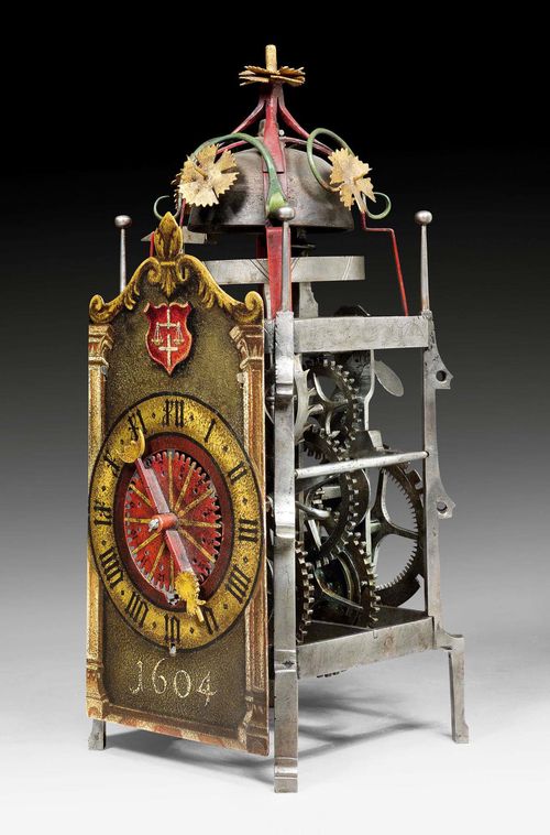 PAINTED IRON CLOCK, Renaissance/early Baroque, monogrammed and dated AL 1604 (Andreas Liechti, 1562-1621), Switzerland. Painted wrought iron. Painted dial and 1 hand with stylized hand and moon. Iron clockwork and striking mechanism. Hour striking on locking plate striker. Restorations and alterations 15.5x16x38 cm.