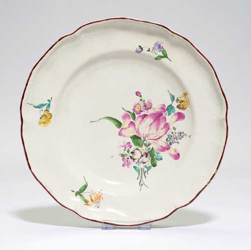FAIENCE PLATE PAINTED WITH FLOWERS,