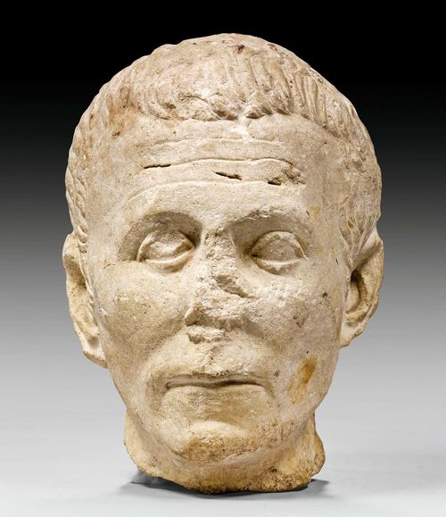 STONE BUST OF A MAN,Roman, 2nd/3rd century AD. Limestone. Signs of weathering. H 24 cm.