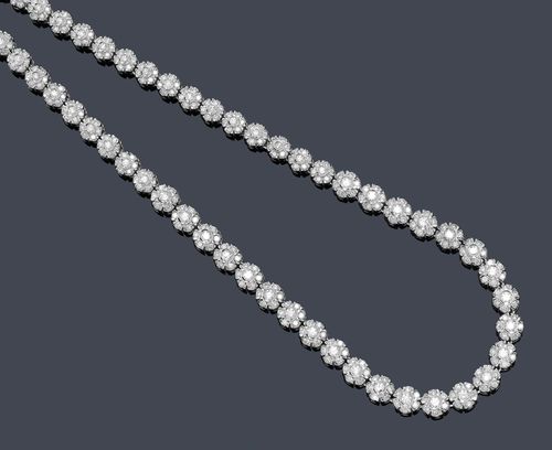 DIAMOND NECKLACE. White gold 585. Elegant, modern necklace of numerous, slightly graduated rosette motifs set throughout with a total of 529 brilliant-cut diamonds weighing ca. 8.99 ct. L ca. 46 cm. Matches the following lot.