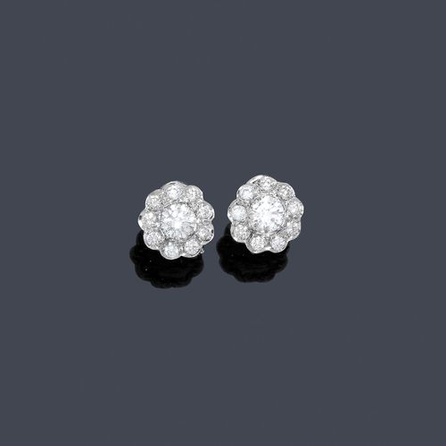 DIAMOND EAR STUDS. White gold 585. Decorative, rosette-shaped ear studs set with 2 central brilliant-cut diamonds weighing ca. 1.40 ct, each within a border of 9 brilliant-cut diamonds, weighing ca. 1.50 ct. Matches the previous lot.