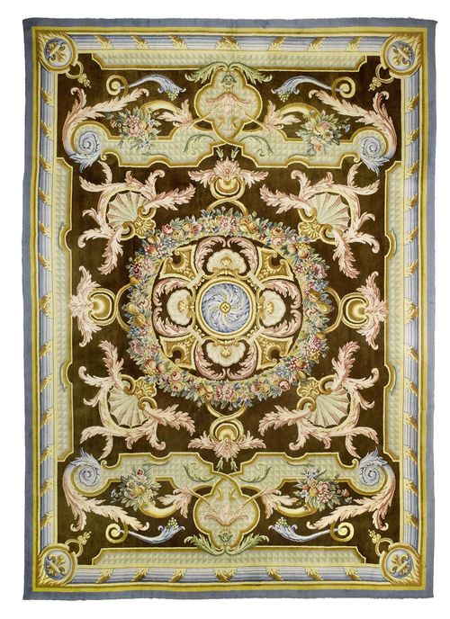EUROPEAN SAVONNERIE old.Brown central field opulently patterned with bulky trailing flowers and classic ornaments in bright colours, blue border, in good condition, 337x463 cm.