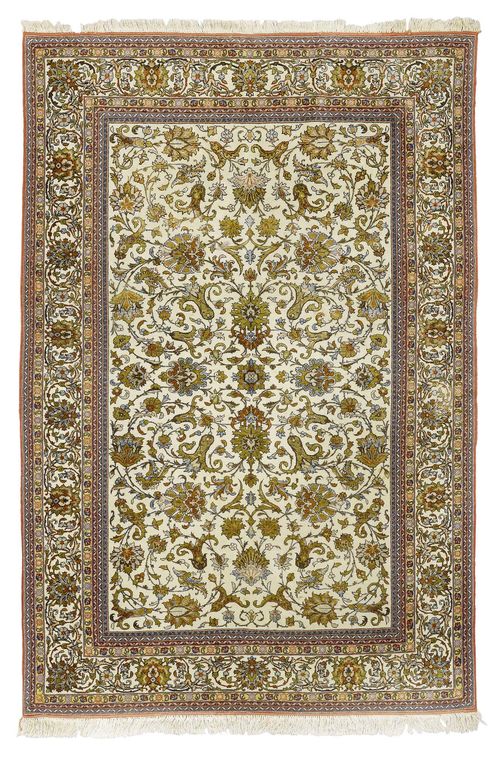 GHOM old.White ground, patterned throughout with trailing flowers and palmettes in shades of green, white edging, slight wear, fringes replaced, 135x210 cm.