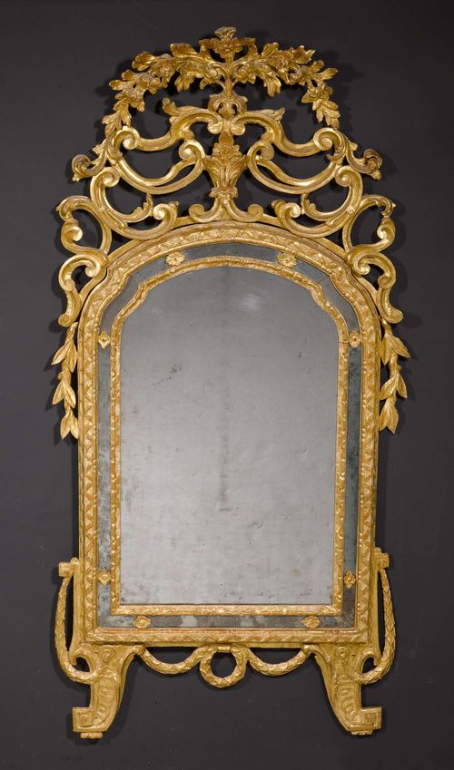 IMPORTANT MIRROR,Louis XV, northern Italy, 18th century. Pierced and exceptionally richly carved giltwood. H 180 cm, W 80 cm.