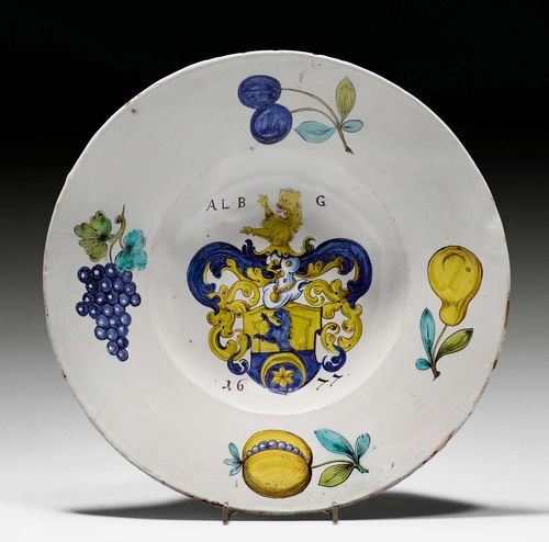 FAIENCE ARMORIAL PLATTER OF THE GROB FAMILY IN HERISAU, Winterthur, dated 1677. With the initials ALB and G and dated 1677. D 34cm. Hairline crack and heavily restored.