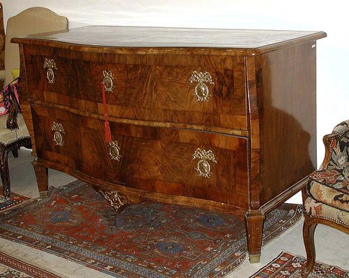 LARGE COMMODE, in theTransition style, Southern German, ca. 1770. Walnut and burlwood in veneer. Rectangular body, the front with 2 drawers. Gilt and engraved bronze mounts with medallion, with a bust of lady and a bust of a gentleman. 163x67x95 cm.