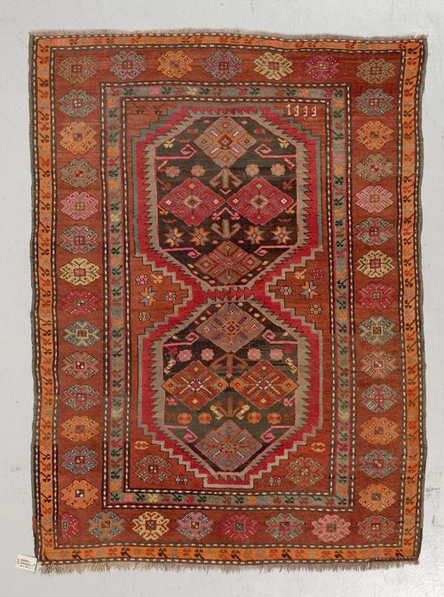 KARS KAZAK old.Brown central field with two medallions, geometrically patterned, brown edging with star motifs, 134x187 cm.