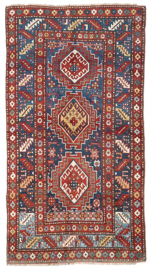 KAZAK antique.Blue central field with three medallions, geometrically patterned, wide edging in blue and red, 130x225 cm.