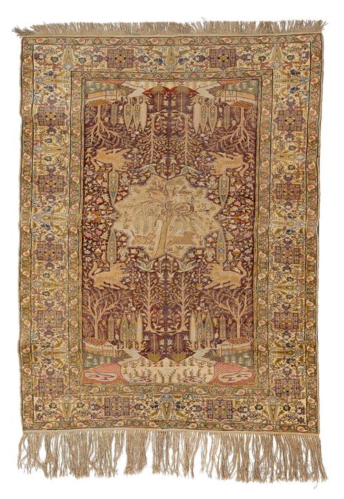 KAYSERI antique.Red ground with a beige central medallion, patterned with plants and animals, white edging, signs of wear, 134x175 cm.