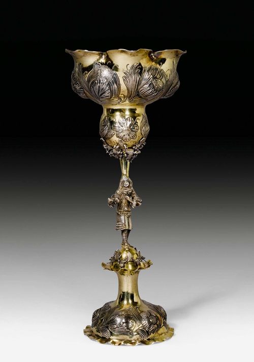 FOOTED GOBLET,Augsburg, mid-17th century. Maker's mark: Christoph Leipzig. The stem in the form of a nobleman. Flower shape, the cup chased and embossed on all sides. H 28.5 cm. 338 g. Provenance: Fritz Payer, Zurich.