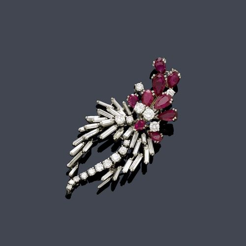 RUBY AND DIAMOND BROOCH, E. MEISTER. Platinum 950. Decorative, elegant brooch designed as a stylized flower, the petals set with 9 drop-cut rubies weighing ca. 2.80 ct, the leaves decorated with 30 baguette-cut diamonds weighing  ca. 1.50 ct and 17 brilliant-cut diamonds weighing ca. 1.00 ct. Ca. 5.5 x 2.8 cm.