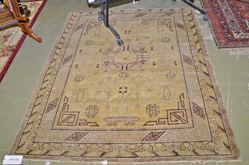 CHINA antique.Patterned in beige and brown, strong signs of wear, 145x200 cm.