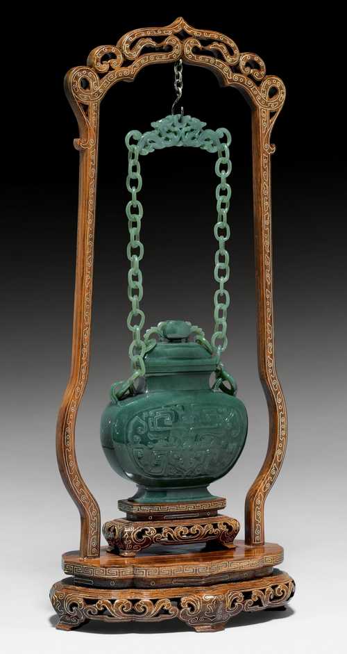A SPINACH-GREEN JADE CHAIN VASE AND COVER.