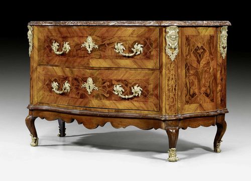 COMMODE,Louis XV, Munich, circa 1740. Walnut, burlwood and local fruitwoods in veneer with exceptionally fine inlays. The front with 2 drawers. Rich gilt bronze mounts and sabots. Shaped "Griotte Rouge" top.130x53x83 cm.