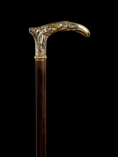 A WALKING STICK WITH SILVER HANDLE,