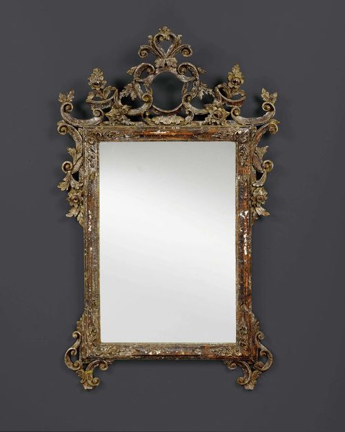 MIRROR,Baroque, Venice, 18th century. Pierced and richly carved wood with remains of old paint. Chips. H 127 cm. W 75 cm.