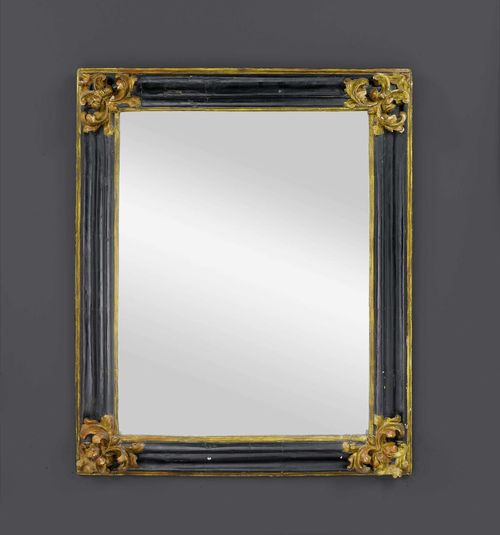 FRAME AS MIRROR,Baroque, northern Italy, 18th century. Richly carved, parcel gilt and ebonized wood. H 104 cm. W 81 cm.
