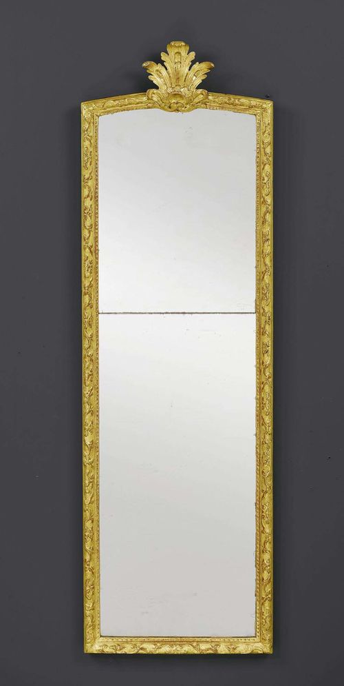 NARROW MIRROR,Regence, France, 18th/19th century. Shaped and finely carved wood. The mirror plate in two parts. H 152 cm. W 45 cm.