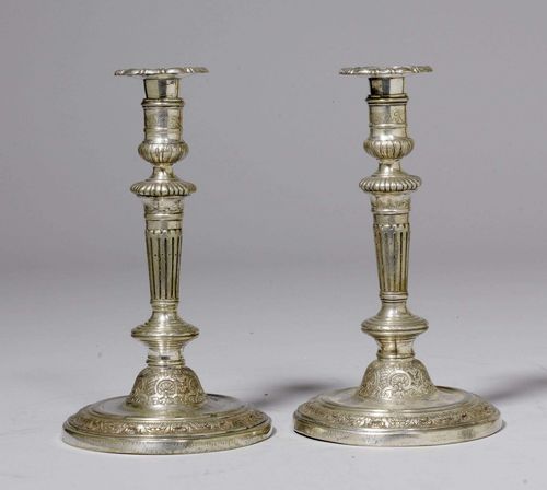 PAIR OF CANDLESTICKS,Regence, Paris circa 1710. Silver-plated bronze. H 25.5 cm. Provenance: from a French collection. Expertise by Cabinet Dillee, Guillaume Dillee/Simon Pierre Etienne, Paris 2012.