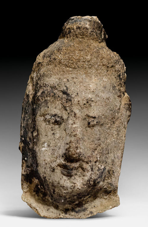 A SMALL SANDSTONE HEAD OF A BUDDHA.
