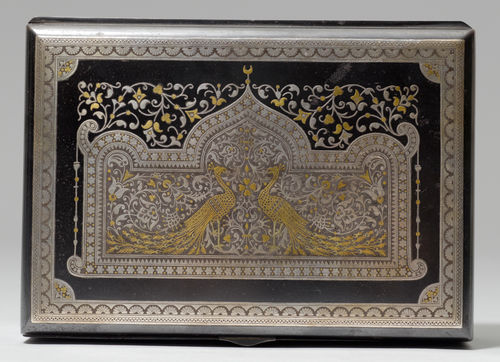 AN IRON CASKET WITH SILVER AND GOLD DAMASCENE DECORATION OF PEACOCKS.