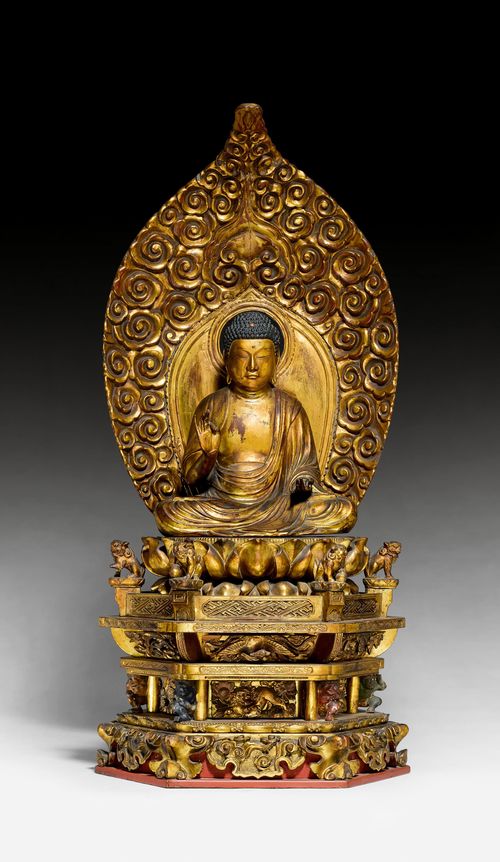 A GILT LACQUER FIGURE OF AMIDA NYÔRAI ON A LOTUS THRONE WITH MANDORLA.