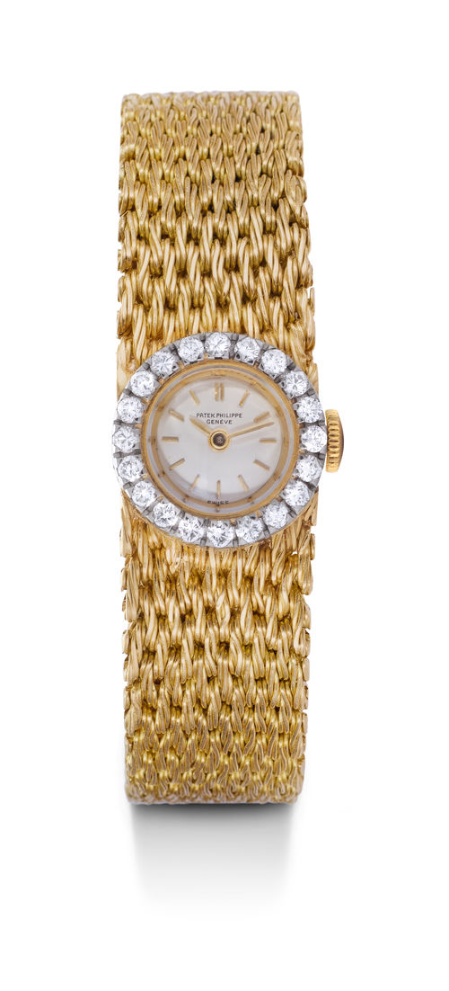 Patek Philippe, elegant lady's wristwatch with gold band, ca. 1965.