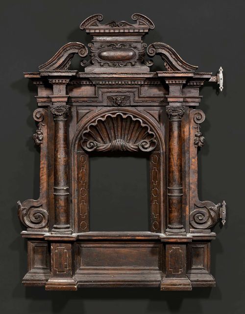 TABERNACLE FRAME,Renaissance, Florence circa 1600. Shaped and finely carved walnut. Some alterations. H 75 cm, W 61 cm.