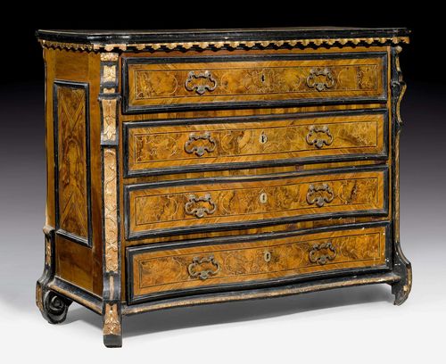 COMMODE,Early Baroque, Lombardy circa 1700. Carved walnut, burlwood and local fruitwoods in veneer, partly ebonized and parcel gilt. Front with 4 drawers. Bronze mounts and drop handles. Some restoration required. 122x58x110 cm.