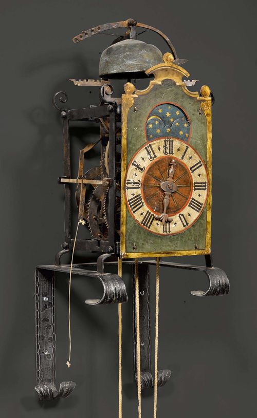 PAINTED IRON CLOCK WITH MOON PHASE,in Gothic style, partly from old elements, in the style of A. LIECHTI (Andreas Liechti, 1562-1621), probably Winterthur. Verge escapement with striking on bell. 45x48x56 cm.