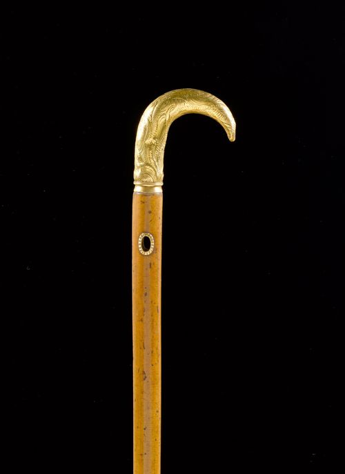 WALKING STICK WITH GOLD SHEET-COVERED GRIP,