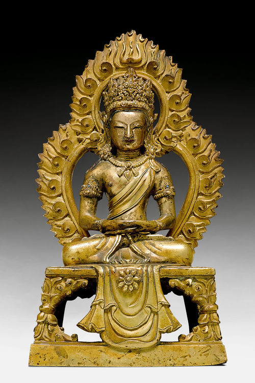 A PARTLY GILT COPPER ALLOY FIGURE OF AMITAYUS WITH AN AUREOLE.
