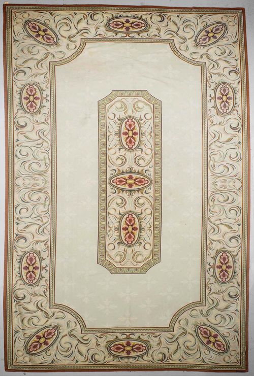 AUBUSSON old.Light green central field with a floral central medallion, wide edging in beige with trailing flowers, 320x580 cm.