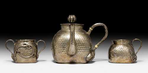 A THREE-PIECE TEASET OF HAMMERED SILVER AND BONE WITH STAMPED FOUR-CHARACTER MARK AND “TUMAOXING” MARK ON THE TEAPOT AND CREAMER.