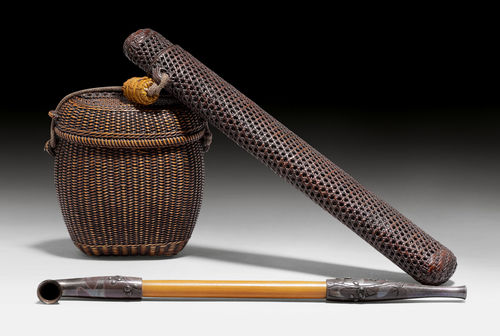 A WOOVEN BAMBOO TABAKO-IRE AND KISERUZUTSU WITH A SILVER MOUNTED PIPE.