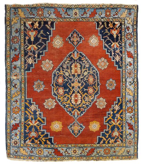 BIDJAR antique.Red ground with dark blue central medallion and corner motifs, patterned with stylized plant motifs, light blue border with trailing flowers, 145x175 cm.