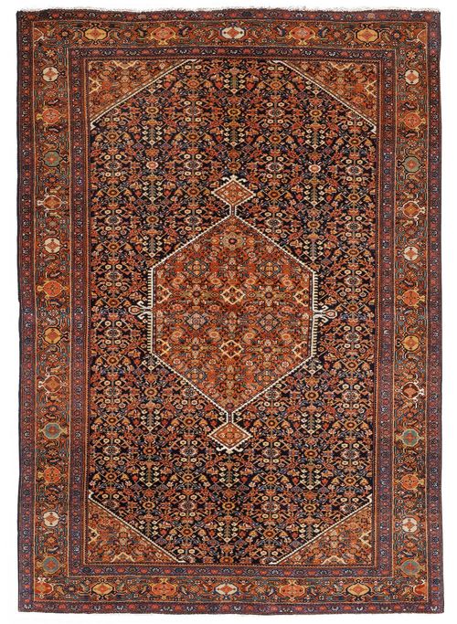 FERAGHAN antique.Black central field with a rust coloured central medallion, herati pattern in pink and green, rust coloured edging, 133x202 cm.