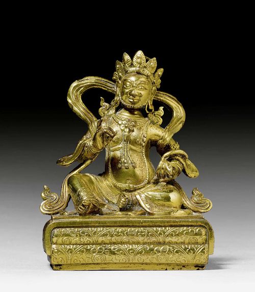 A GILT BRONZE FIGURE OF JAMBHALA. Tibeto-chinese, 18th c. Height 8.5 cm. The banner is lost.