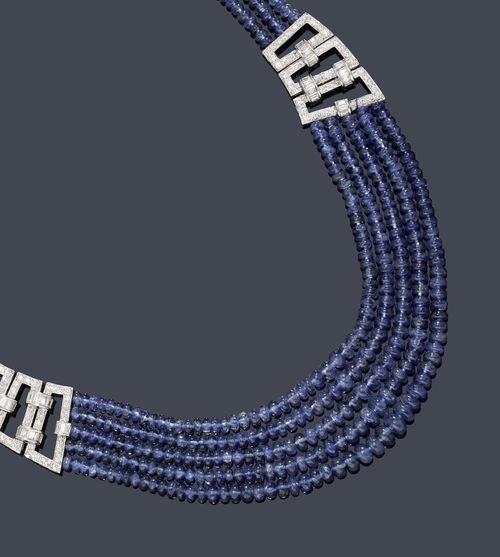 SAPPHIRE AND DIAMOND NECKLACE. White gold 750. Casual, decorative multiple-row necklace of numerous graduated sapphire rondelles, of ca. 2.8 - 6.7 mm Ø, untreated, decorated towards the front with 2 geometric elements, each set throughout with 48 brilliant-cut diamonds, and additional ring motifs with baguette-cut diamonds. Clasp additionally decorated with 23 brilliant-cut diamonds. Total sapphire weight ca. 250 ct and total diamond weight ca. 4.70 ct. L ca. 44 cm. Matches the following lot. With GJEPC Report No. I1635CA69819, for the testing of one bead, March 2012.