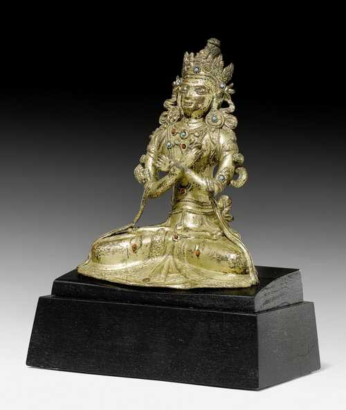A GILT COPPER ALLOY FIGURE OF VAJRADHARA WITH STONE INLAYS.