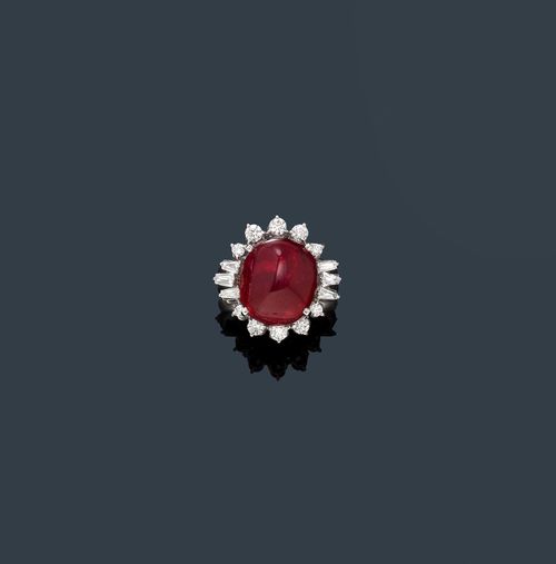 BURMA SPINEL AND DIAMOND RING. White gold 750. Decorative, elegant ring. The top set with 1 red spinel cabochon weighing 14.24 ct, unheated, within a border of 6 trapeze-cut diamonds and 10 brilliant-cut diamonds weighing ca. 1.02 ct in total. Size ca. 55. With GRS Report No. GRS2013-103025, December 2013.